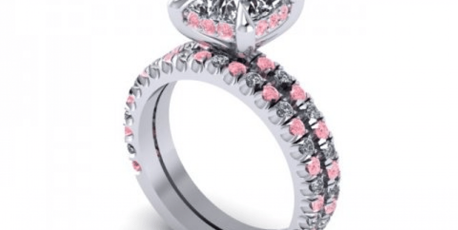 A white gold ring with pink and black diamonds