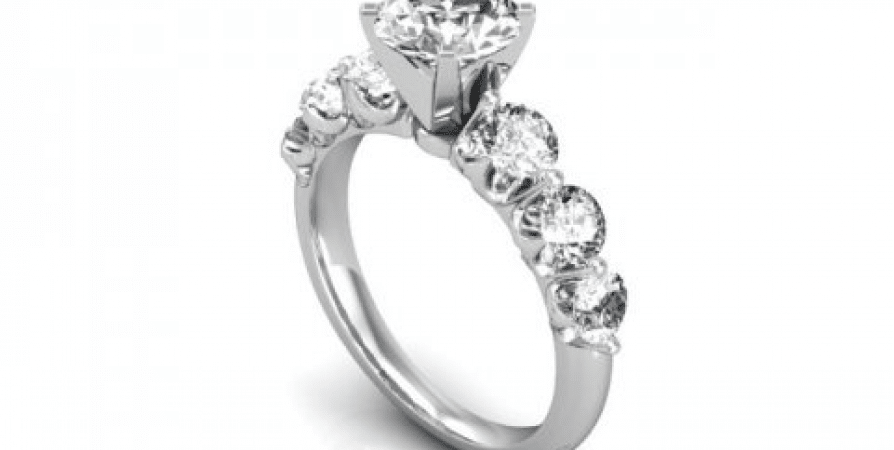 A white gold engagement ring with round diamonds.