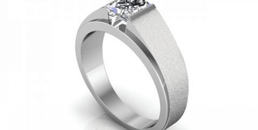 A white gold engagement ring with a princess cut diamond.