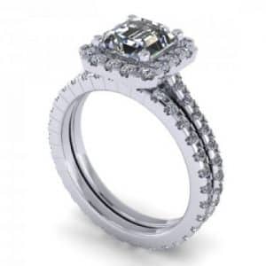 An oval diamond halo engagement ring in white gold.