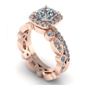 A rose gold engagement ring with a cushion cut diamond.