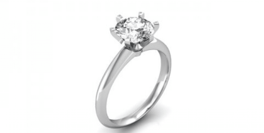 A white gold ring with a single diamond