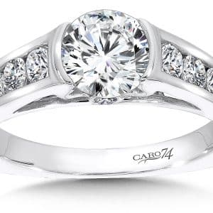 A white gold engagement ring with channeled diamonds