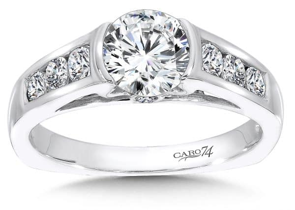 A white gold engagement ring with channeled diamonds